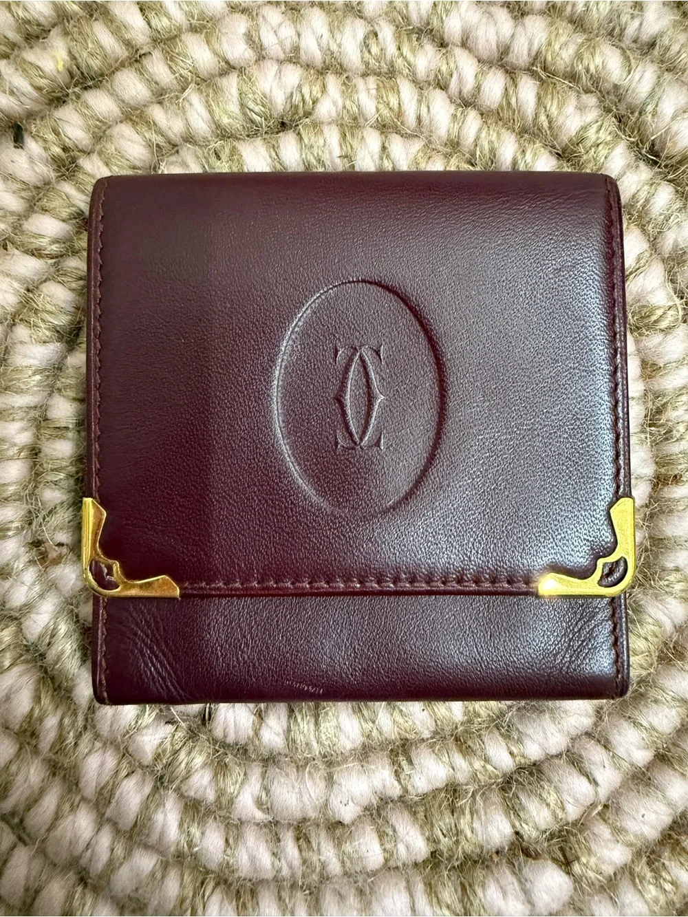 Cartier Deep Burgundy Leather Compact Wallet with Gold Accents